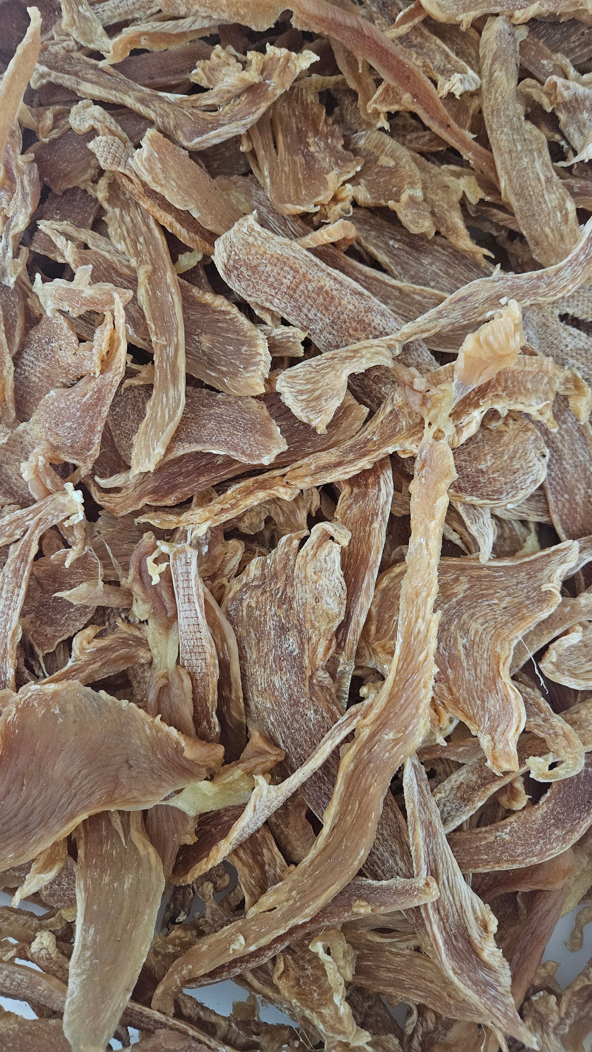 Dehydrated chicken breast jerky, sliced single ingredient muscle meat, no bone