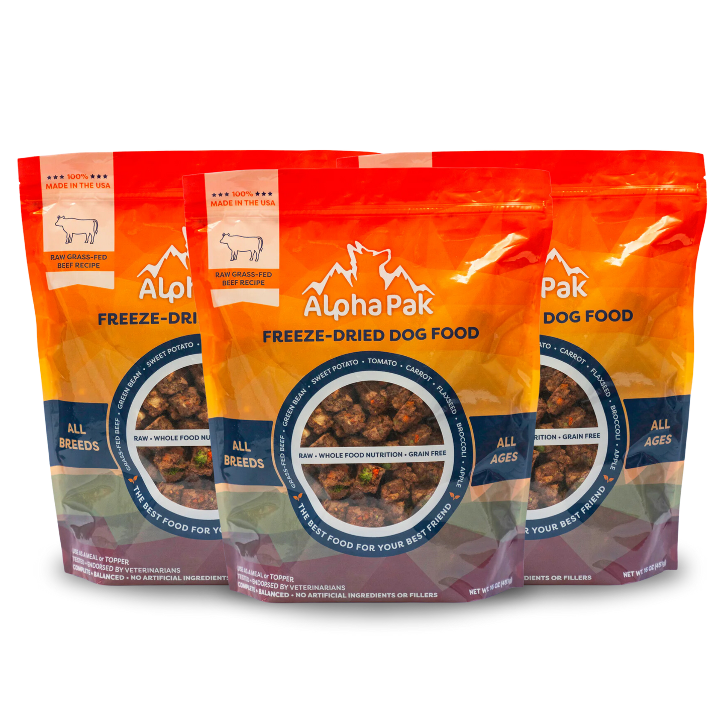 Three packages of Alpha Pak freeze-dried dog food on a white background