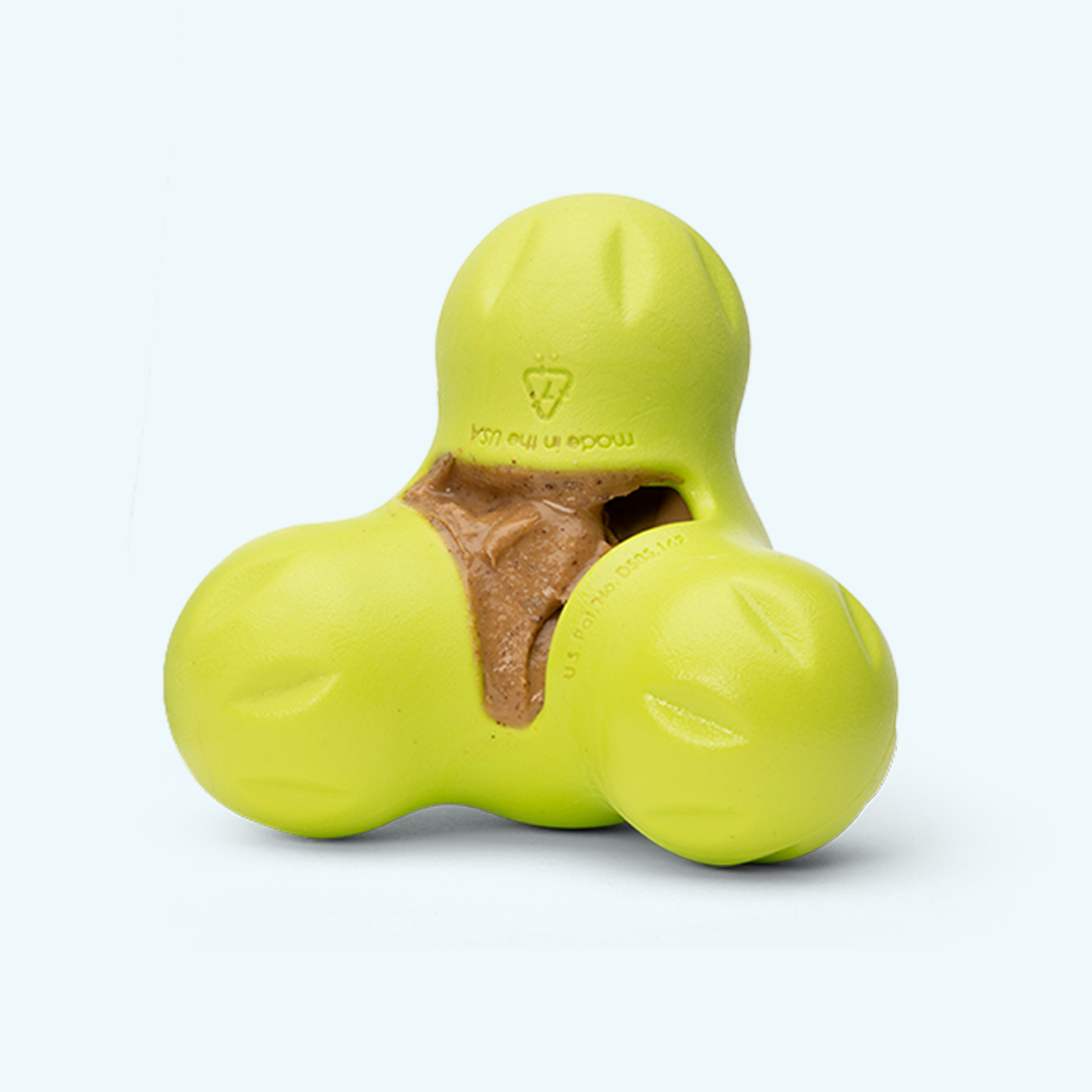 Yellow dog toy with a brown center on a white background