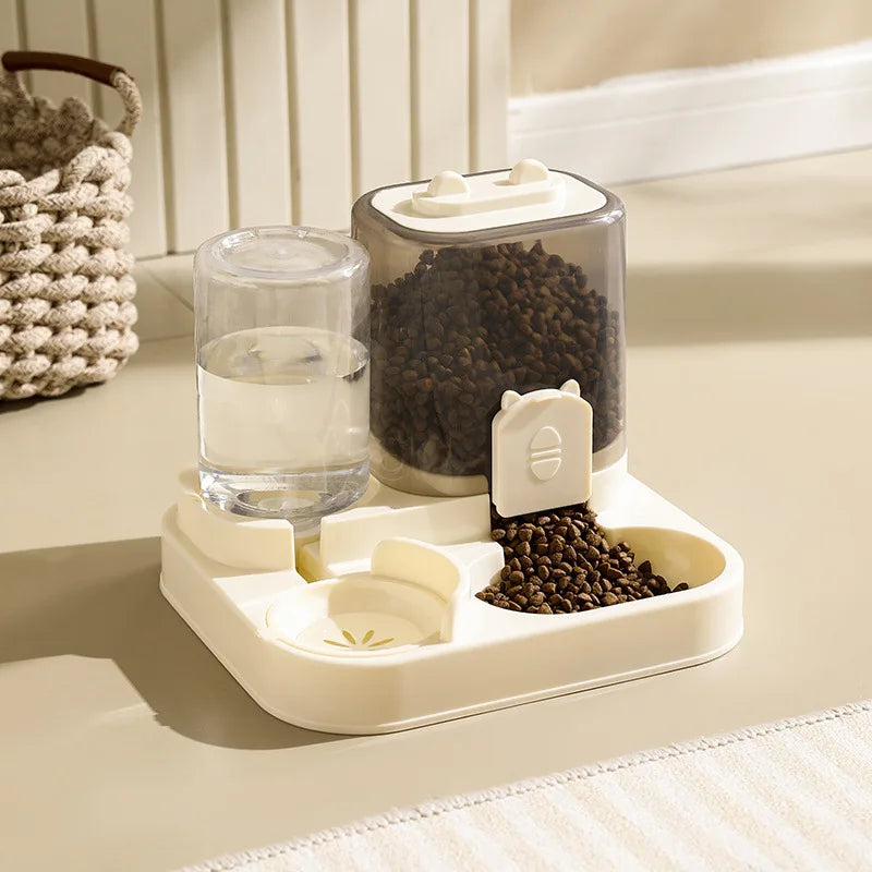 Pet feeding and water station with glass water bowl and container on a light surface.