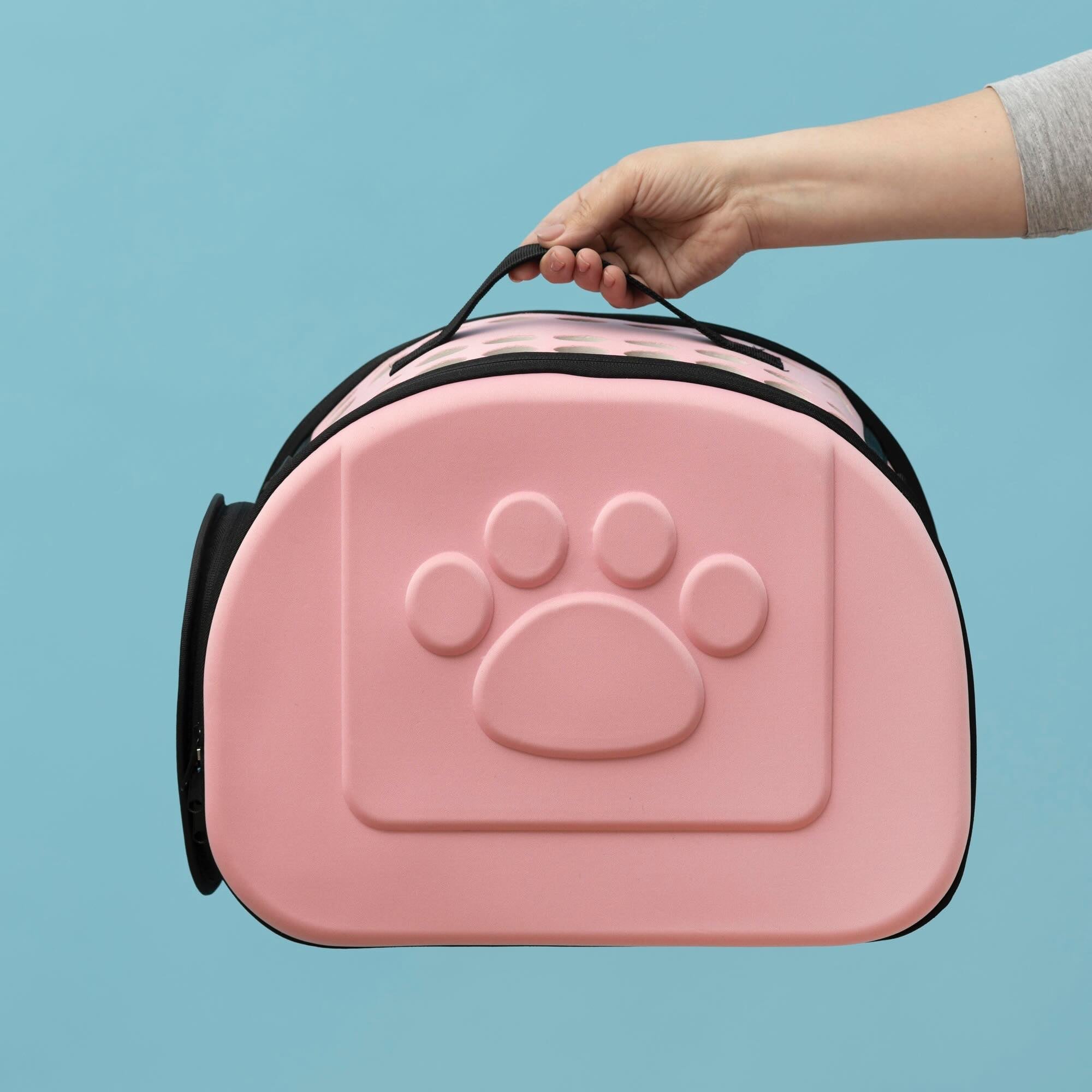 A pink pet carrier.
