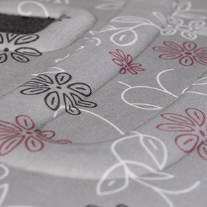 Close-up of a fabric with floral patterns on a gray background