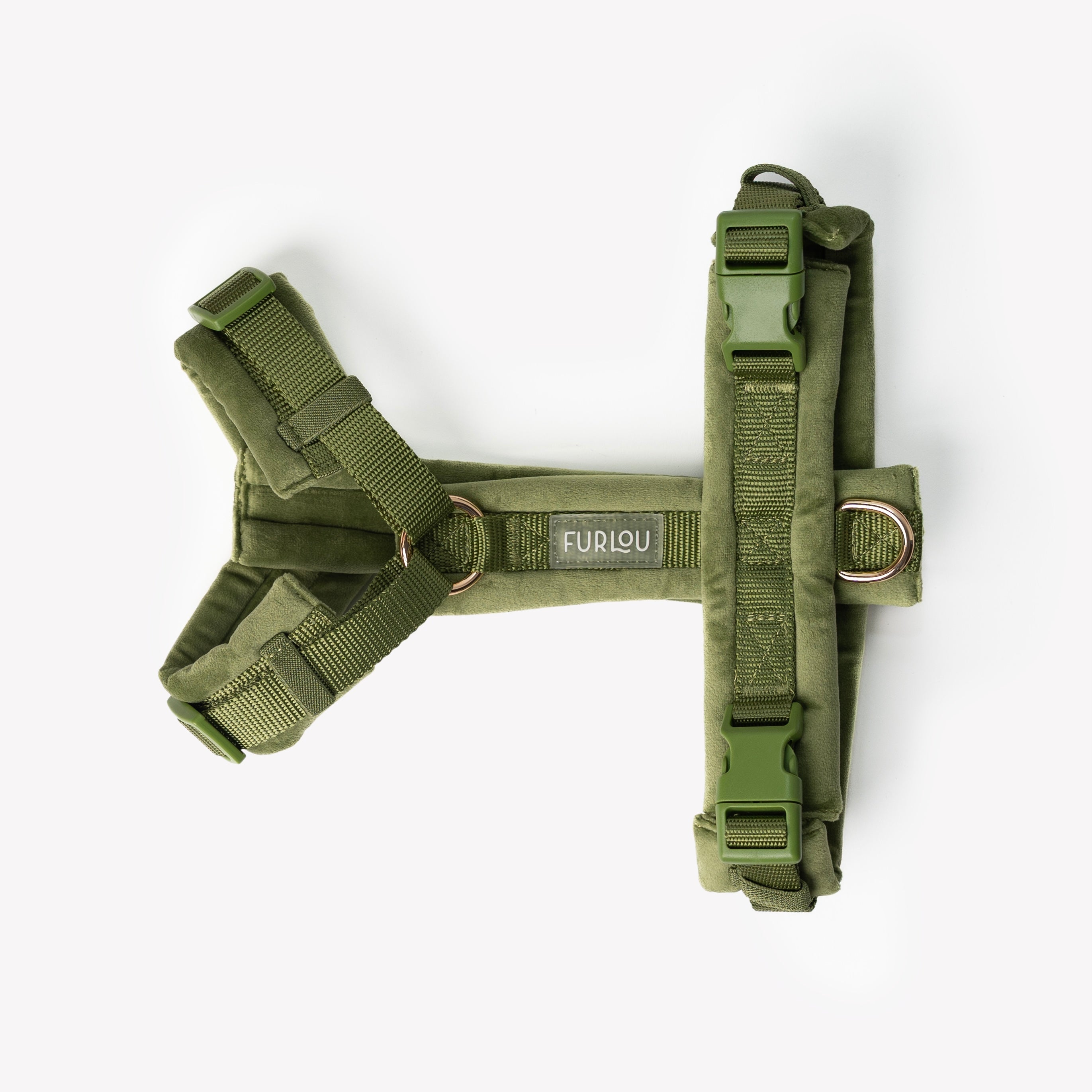 Green dog harness with visible brand logo on a white background