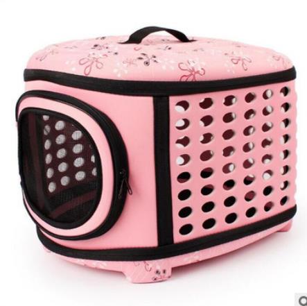Pink pet carrier with floral patterns on a white background