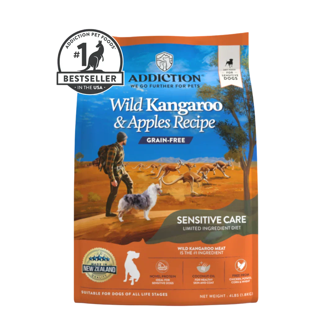 A bag of Addiction Pet Foods Wild Kangaroo & Apples Recipe Grain-Free Sensitive Care dog food, featuring a blue and orange design with an illustration of a person walking a dog in an Australian outback landscape. A 'Bestseller' badge is visible in the top left corner.