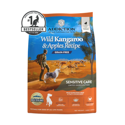 A bag of Addiction Pet Foods Wild Kangaroo & Apples Recipe Grain-Free Sensitive Care dog food, featuring a blue and orange design with an illustration of a person walking a dog in an Australian outback landscape. A 'Bestseller' badge is visible in the top left corner.