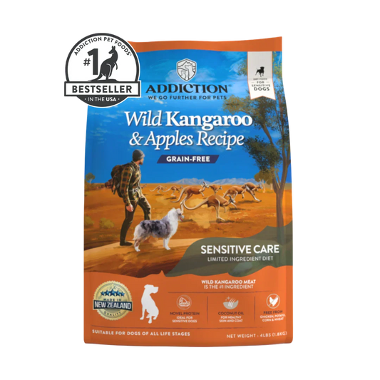 A bag of Addiction Pet Foods Wild Kangaroo & Apples Recipe Grain-Free Sensitive Care dog food, featuring a blue and orange design with an illustration of a person walking a dog in an Australian outback landscape. A 'Bestseller' badge is visible in the top left corner.