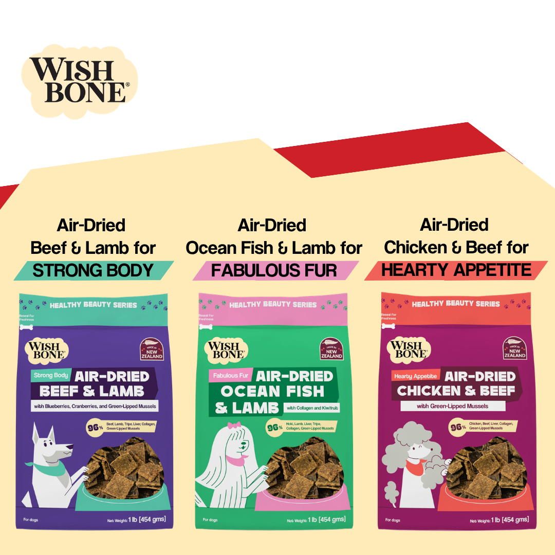 Three packages of Wish Bone air-dried dog food with different flavors on a white background.