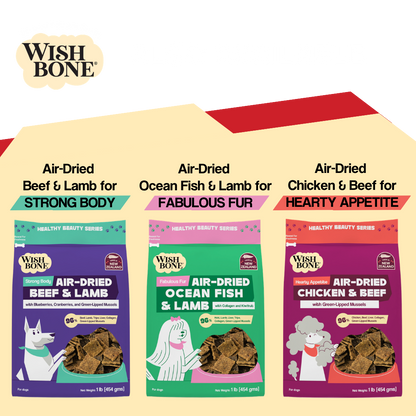 Three packages of Wish Bone air-dried dog food with different flavors on a white background.
