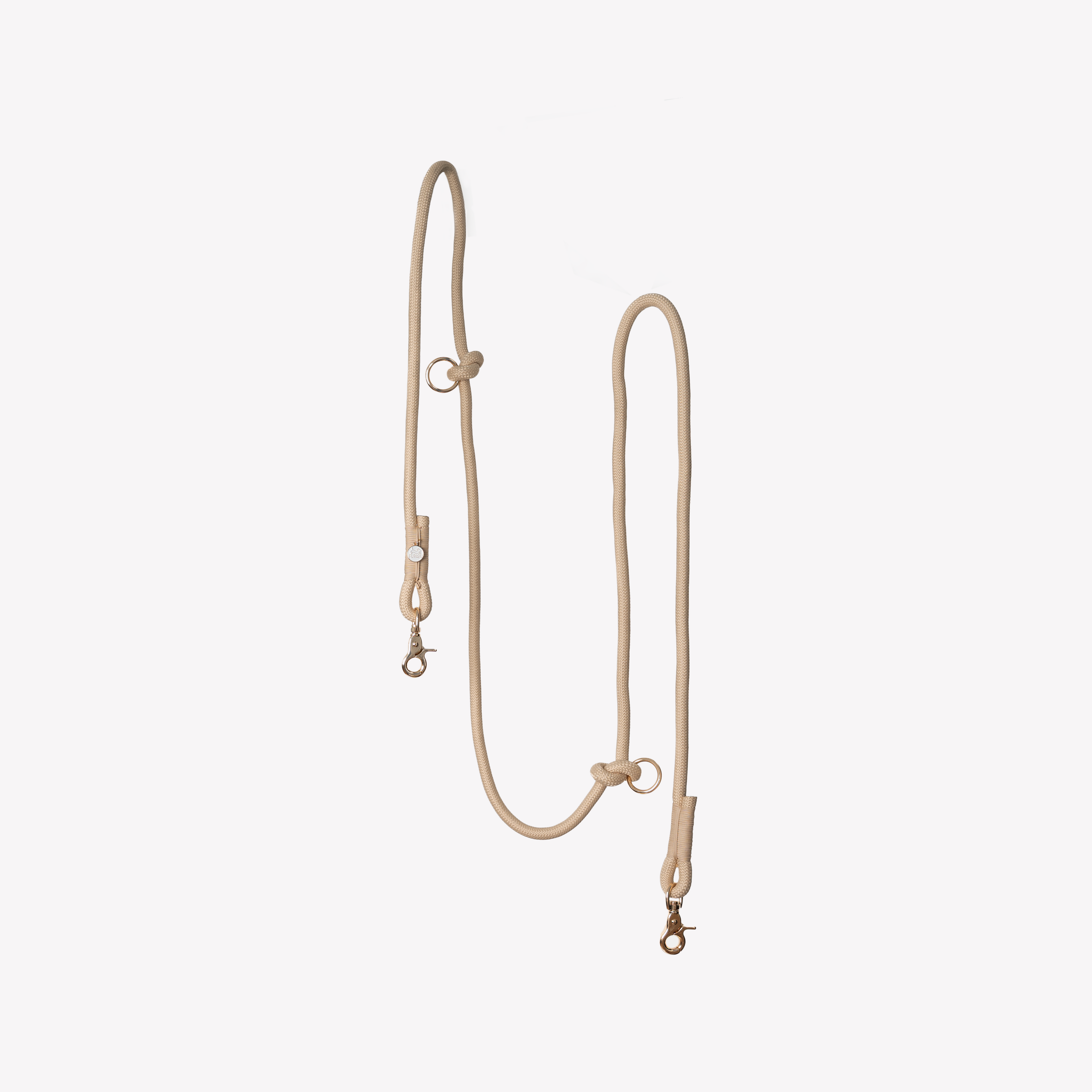 Beige leather dog leash on a white background