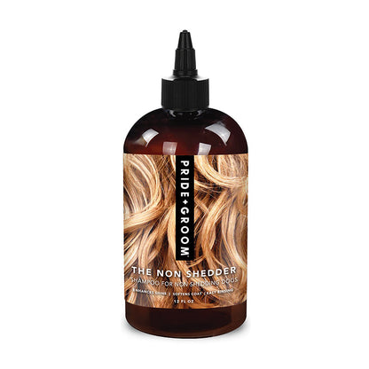Bottle of Pride Groom The Non Shedder shampoo for dogs on a white background