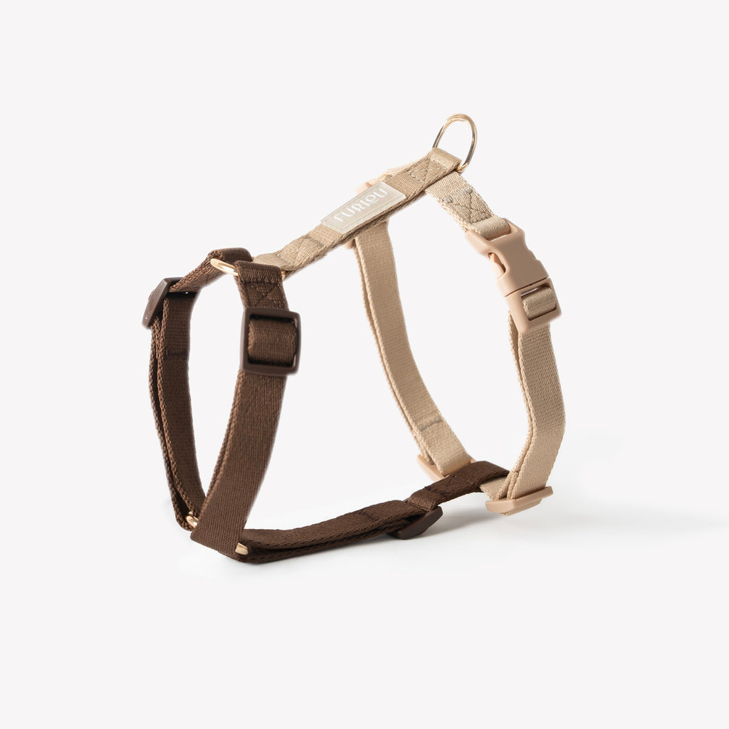 Brown and beige dog harness on a white background