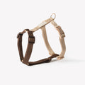 Brown and beige dog harness on a white background