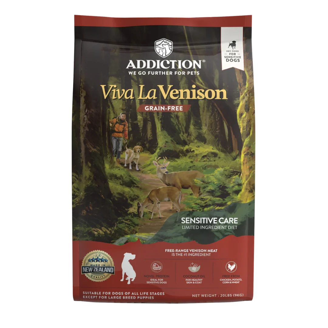 A bag of Addiction Viva La Venison grain-free dog food for sensitive care, featuring a forest illustration with deer and a dog on the front packaging.