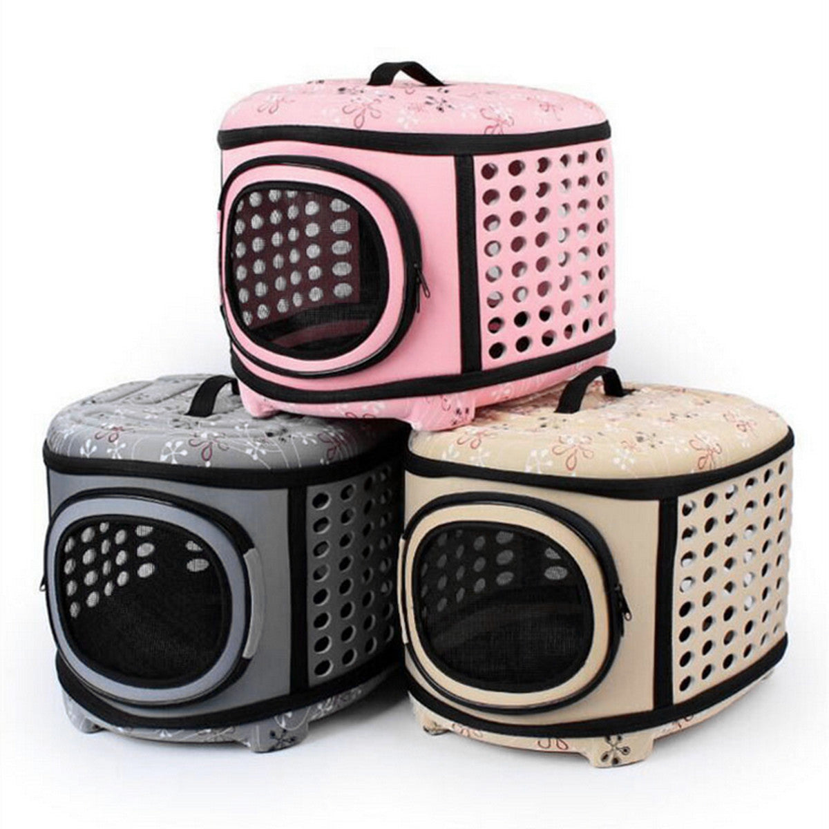 Three pet carriers in different colors on a white background