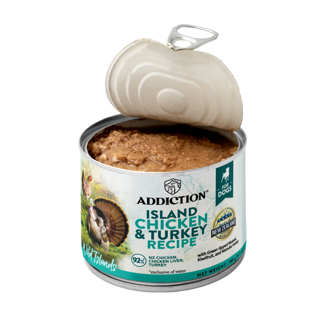 Open can of Addiction Island Chicken & Turkey Recipe pet food on a white background