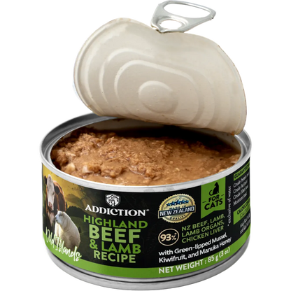 Open can of Addiction Highland Beef & Lamb Recipe cat food on a white background