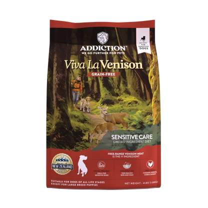 Dog food package with 'Addiction' branding and a forest scene on the label.