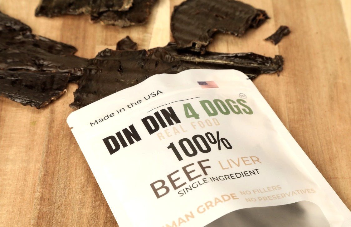 DIN DIN 4 DOGS 100% Beef Liver dog food package on a wooden surface