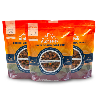 Three packages of Alpha Pak freeze-dried dog food on a white background