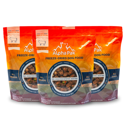 Three packages of Alpha Pak freeze-dried dog food on a white background