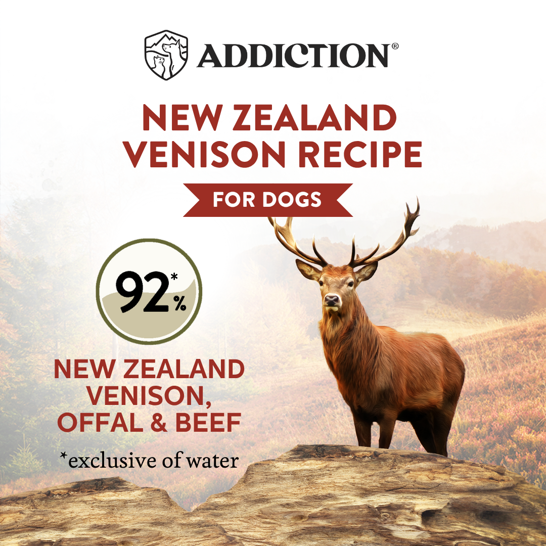 Advertisement for Addiction New Zealand Venison recipe dog food with a deer on a mountain background.