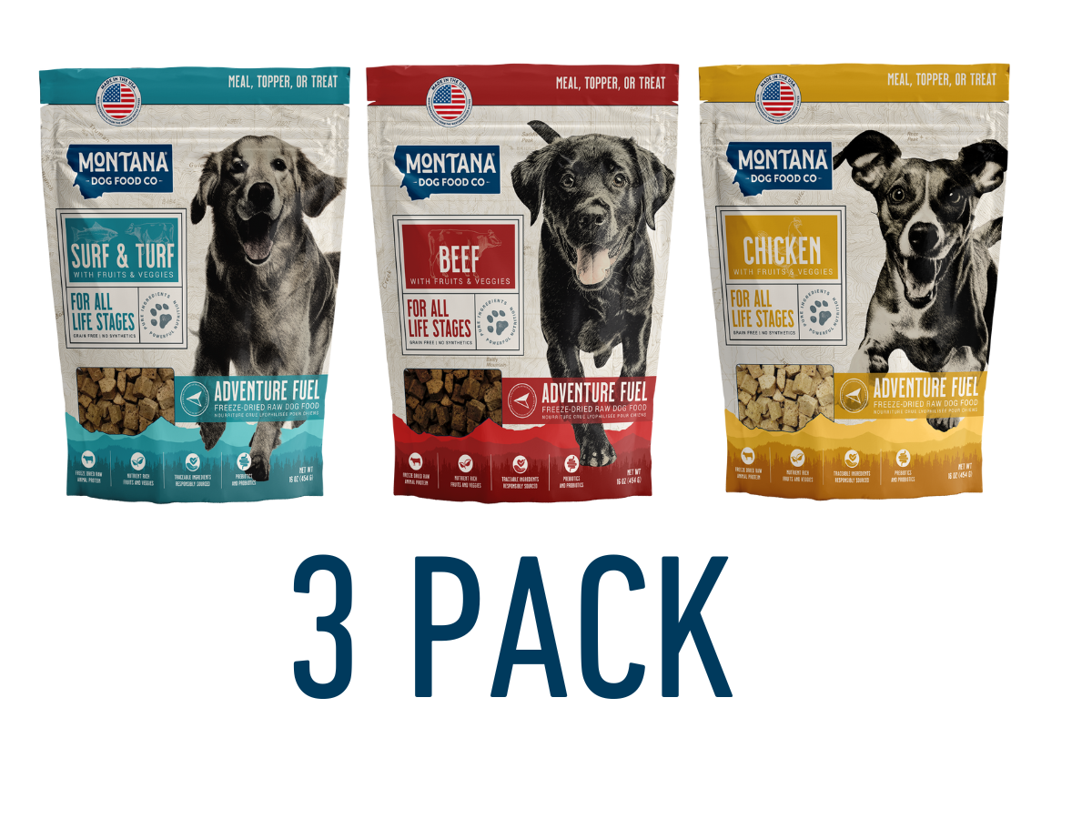 Three packages of Montana Dog Food Co. dog food with images of dogs on a white background.