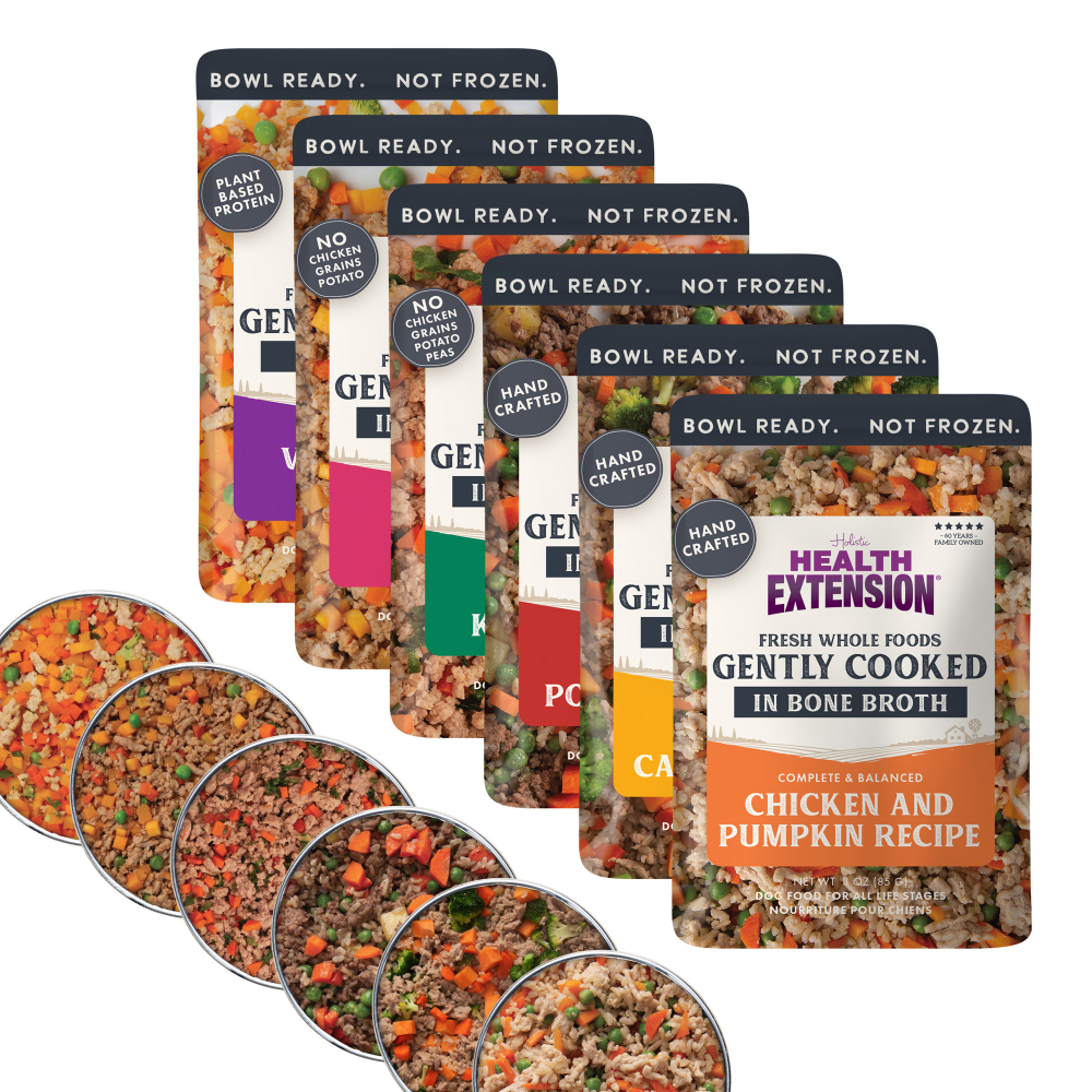 Multiple packages of Health Extension pet food with visible ingredients.