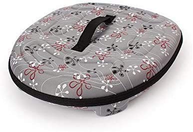 Floral-patterned cushion with a handle on a white background