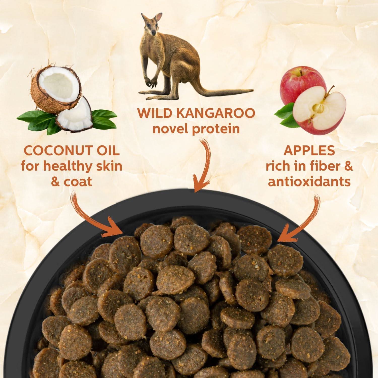 Dog food with ingredients labeled including wild kangaroo, coconut oil, and apples on a beige background.