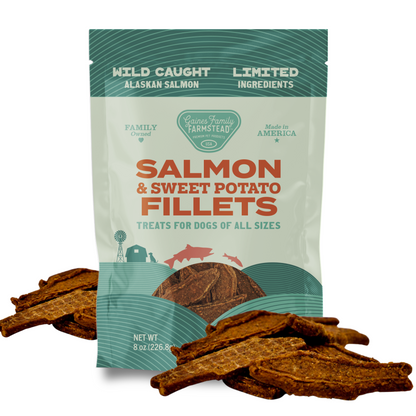 Package of salmon and sweet potato fillets treats for dogs with visible treats on a white background