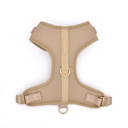 Beige dog harness on a white background