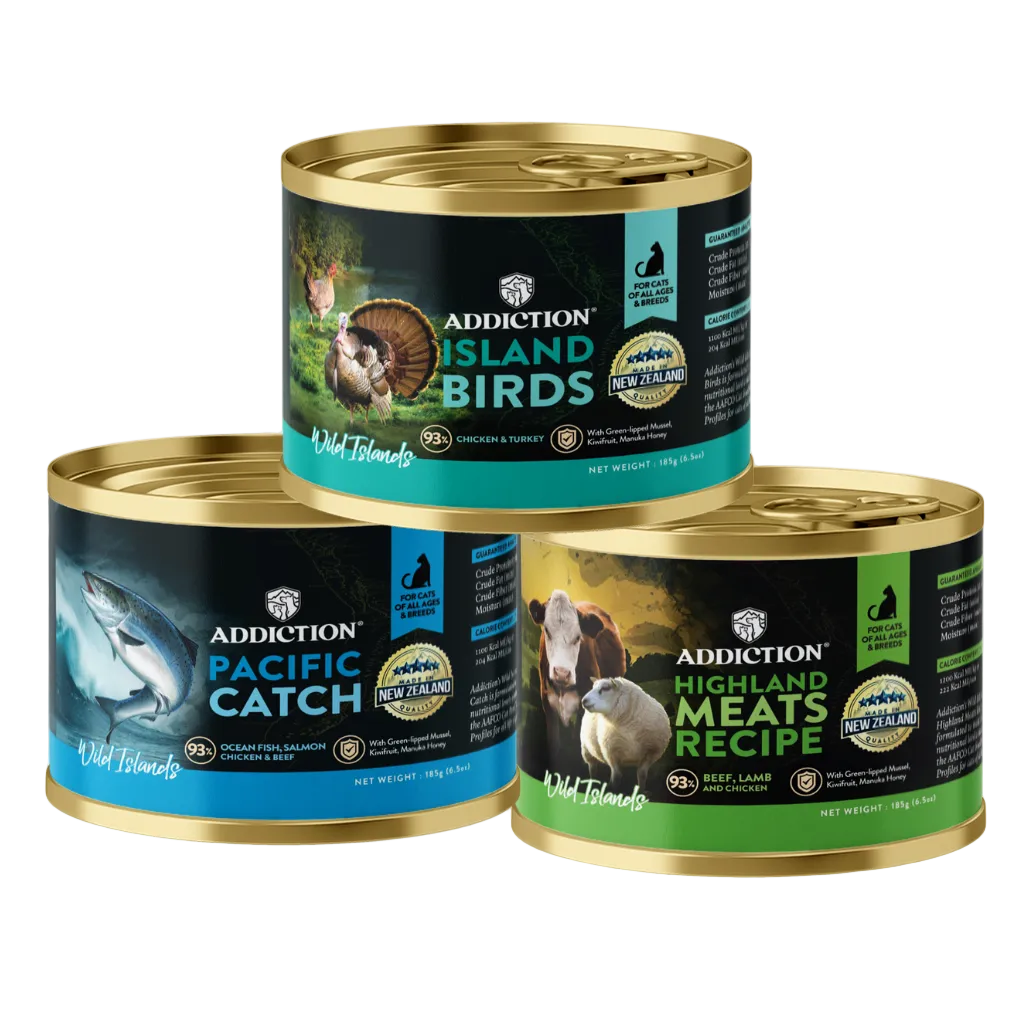 Three cans of Addiction pet food with different labels on a white background