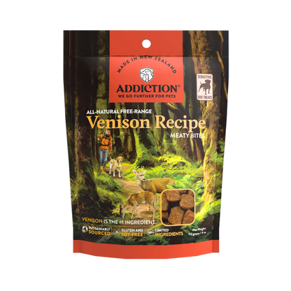 Addiction Venison Recipe dog food package in a forest setting