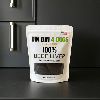 Package of DIN DIN 4 DOGS 100% Beef Liver dog food on a black surface.