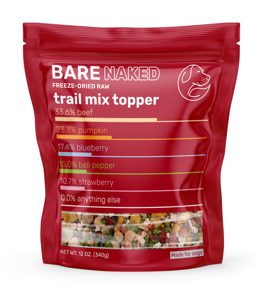 Red package of Bare Naked freeze-dried raw trail mix topper on a white background
