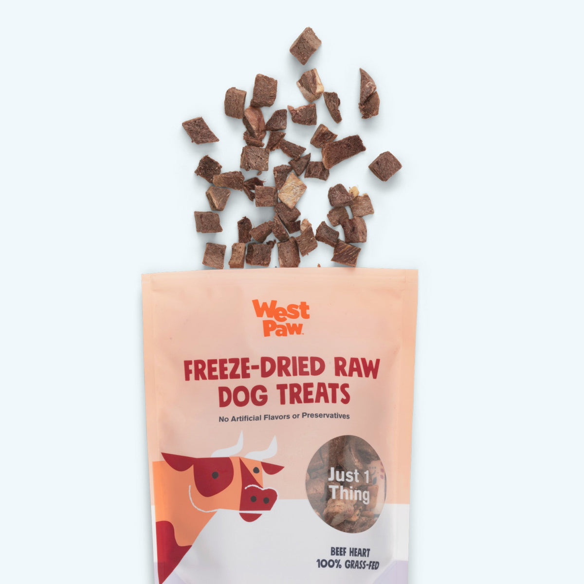 West Paw Freeze-Dried Raw Dog Treats packaging with treats spilling out on a white background