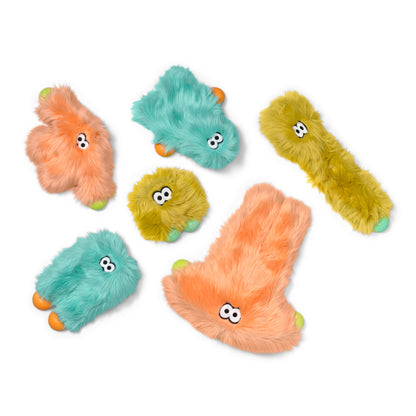 Set of colorful plush toys with googly eyes on a white background