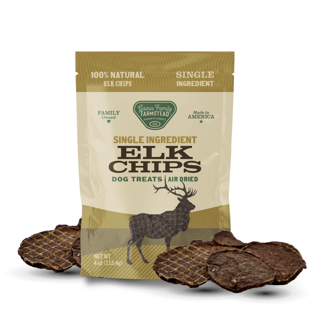 Package of single-ingredient elk chips dog treats with visible treats on a white background