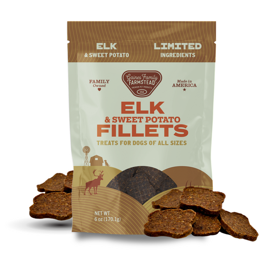 Package of Elk & Sweet Potato Fillets dog treats with visible treats on a white background