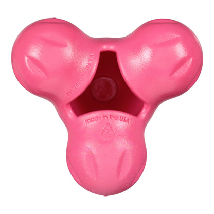 Pink dog toy with a star-shaped center on a white background