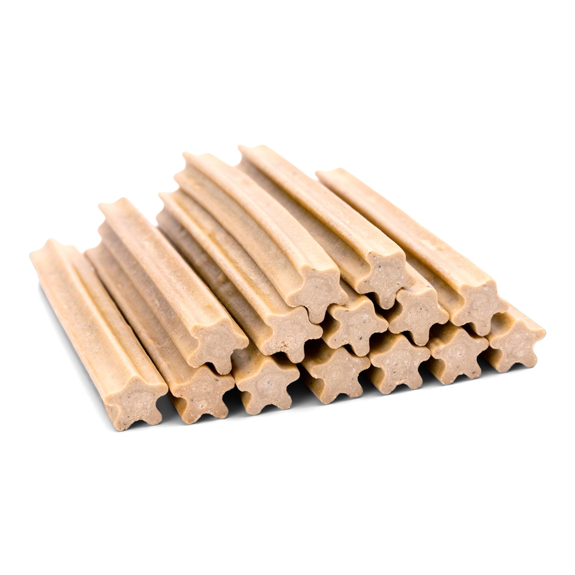 Stack of beige dog chew sticks on a white background