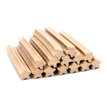 Stack of beige dog chew sticks on a white background