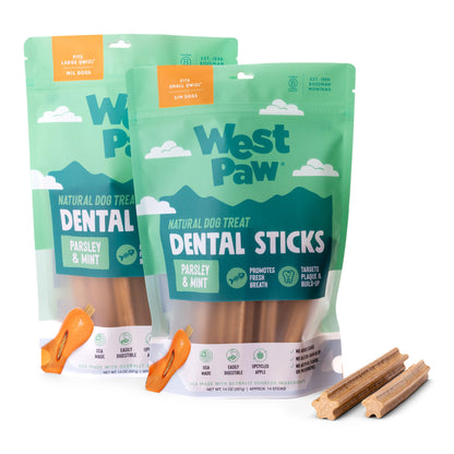 Two packages of West Paw Dental Sticks dog treats with two sticks displayed in front.