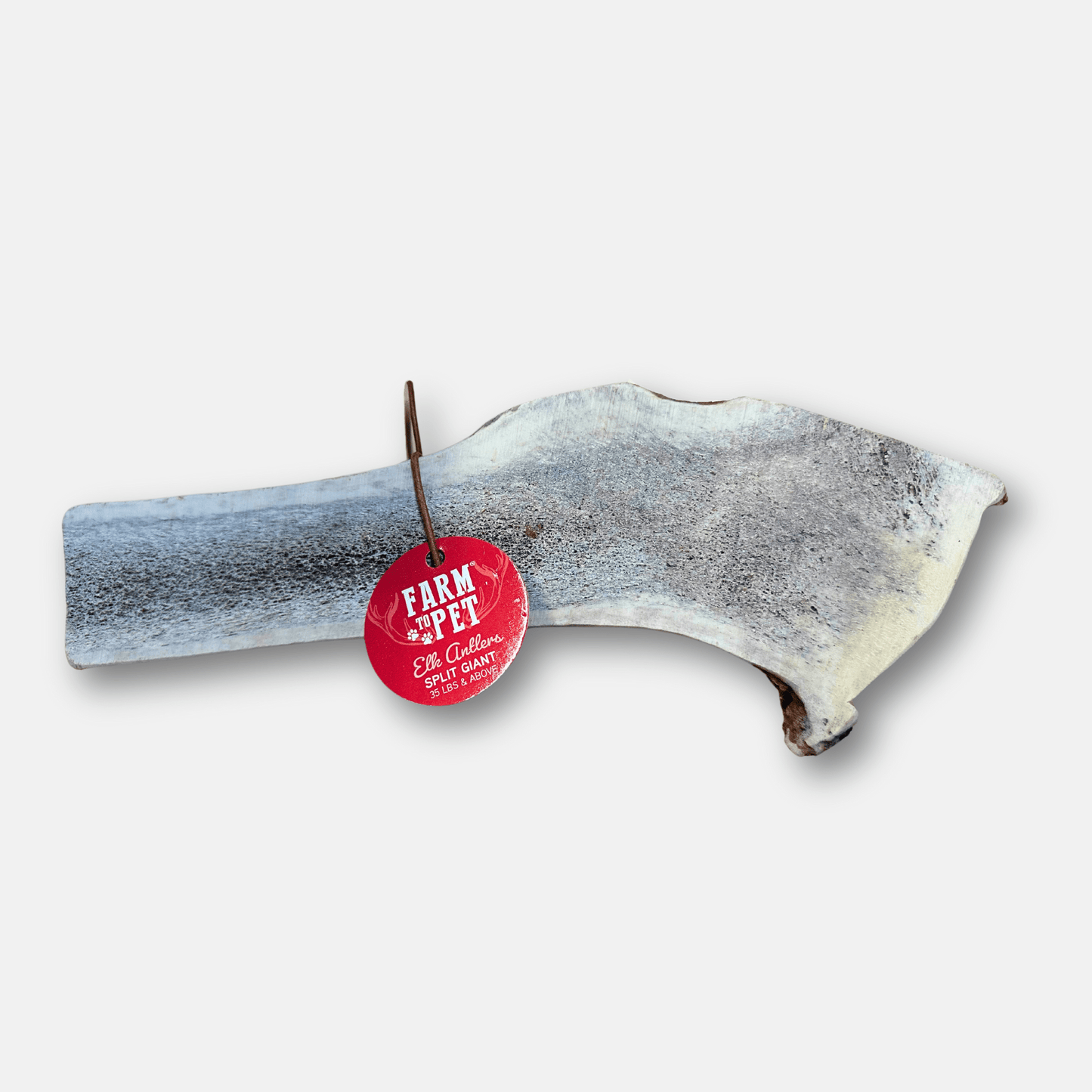 Dog chew treat with a 'Farm to Pet' tag on a white background