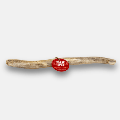Rawhide bone with a red 'Farm to Pet' tag on a white background