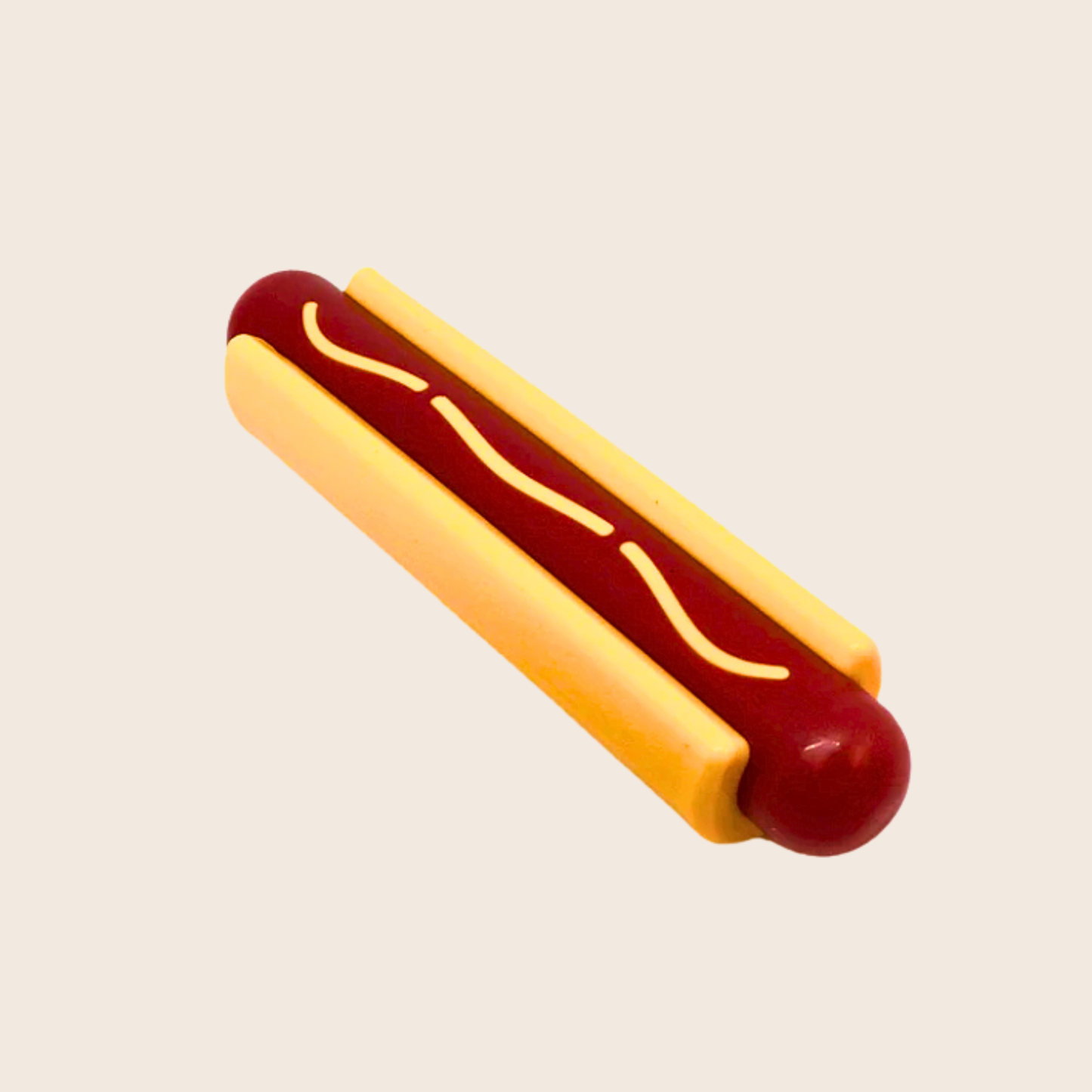 Hot dog with mustard on a beige background