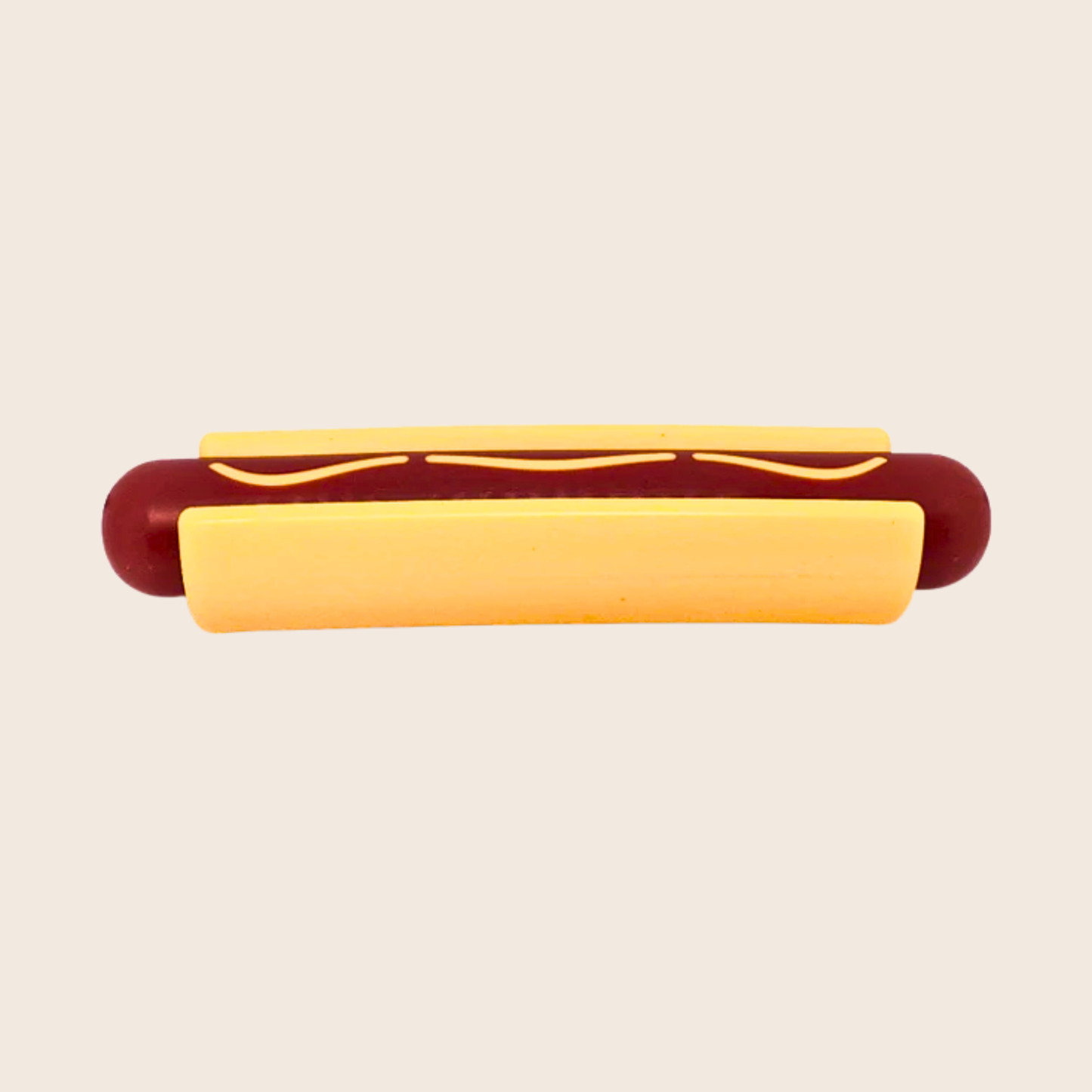 Hot dog with a bun on a beige background