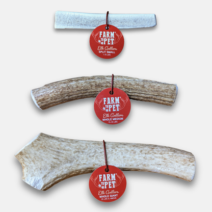 Three deer antlers of varying sizes with red circular Farm & Pet brand tags, arranged vertically on a plain white background.