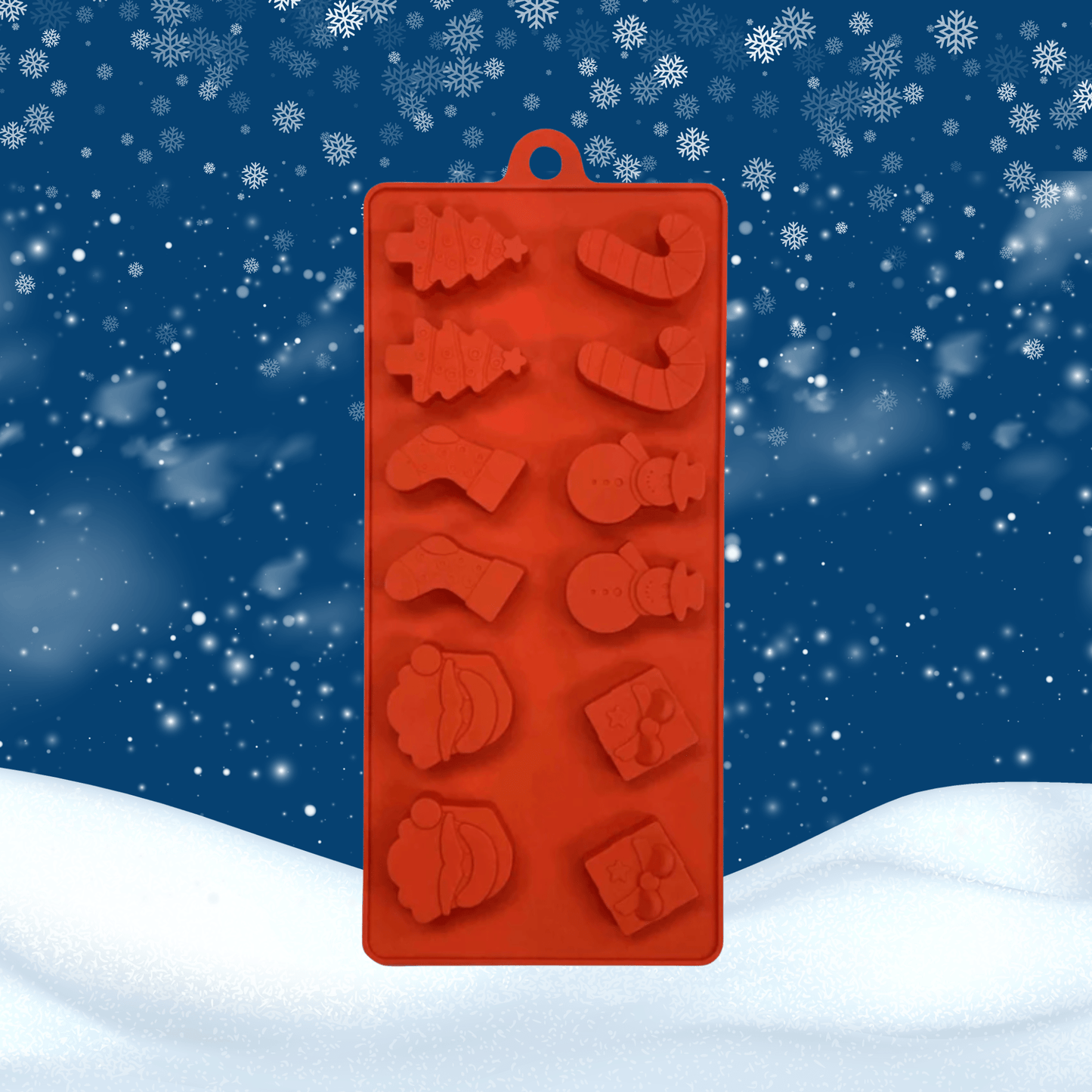 A red silicone mold tray with Christmas-themed cavities, shown against a snowy winter night background with snowflakes.